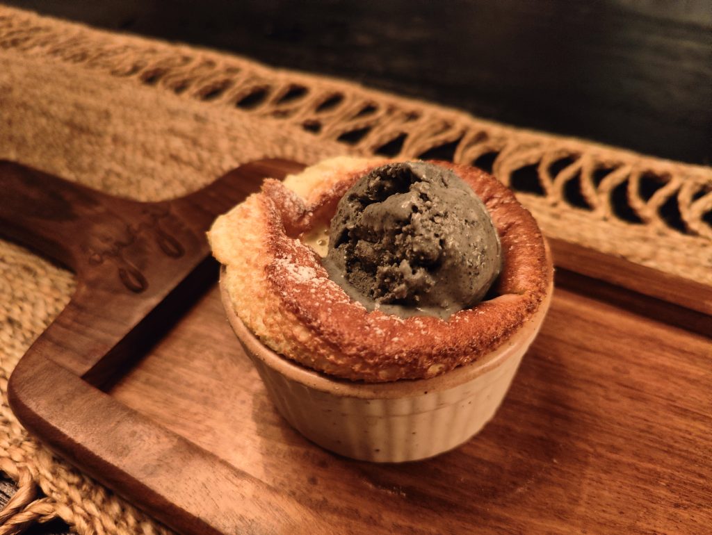 Japanese Souffle with crème anglaise and black sesame ice-cream. Photo courtesy: Gigi, Bandra